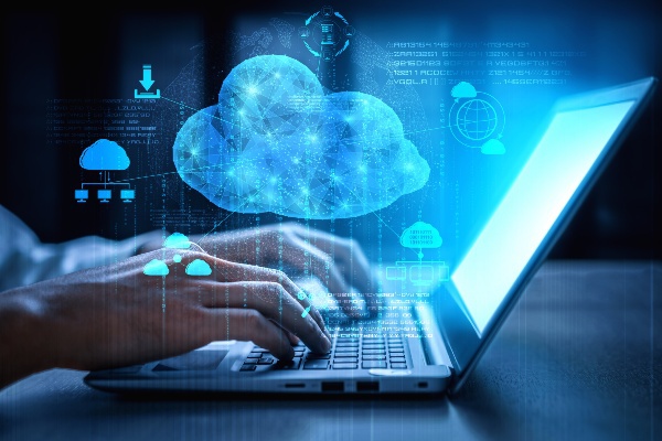 Laptop with a futuristic cloud hovering above